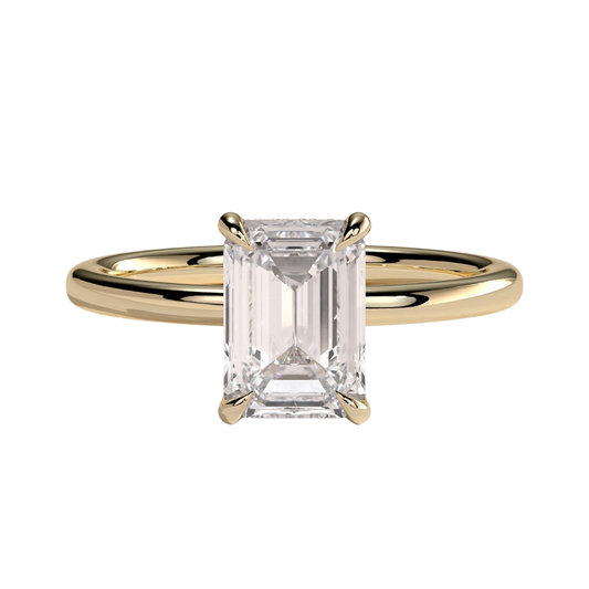 Luxury emerald claw solitaire engagement ring featuring a brilliant emerald-cut center stone secured in a refined claw setting with a sparkling hidden halo beneath the center stone. Elegant timeless design crafted for exceptional brilliance and sophistication, available in white gold, yellow gold, rose gold, platinum, lab-grown diamond, or moissanite options.