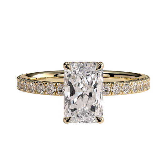 Luxury radiant claw solitaire engagement ring featuring a brilliant radiant-cut center stone secured in a refined claw setting with a sparkling hidden halo and pavé diamond band. Elegant timeless design crafted for exceptional brilliance, sophistication, and lasting beauty, available in white gold, yellow gold, rose gold, platinum, lab-grown diamond, or moissanite options.