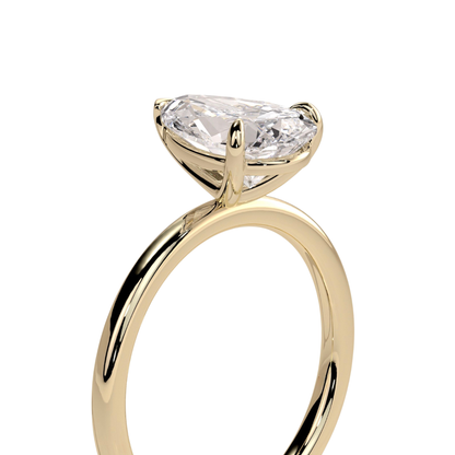 Luxury pear claw solitaire engagement ring featuring a brilliant pear-cut center stone secured in a refined claw setting for maximum sparkle and elegance. Timeless minimalist design crafted for everyday sophistication, available in white gold, yellow gold, rose gold, platinum, lab-grown diamond, or moissanite options.