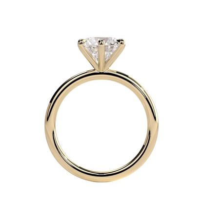 Round claw solitaire engagement ring featuring a brilliant round-cut center stone secured in a classic claw setting with a refined, elevated profile. Timeless and elegant design crafted to maximize sparkle and brilliance, available in white gold, yellow gold, rose gold, platinum, lab-grown diamond, or moissanite options.
